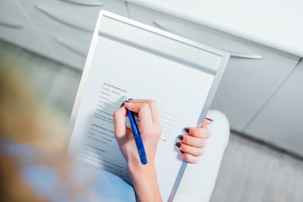 Woman filling a patient form